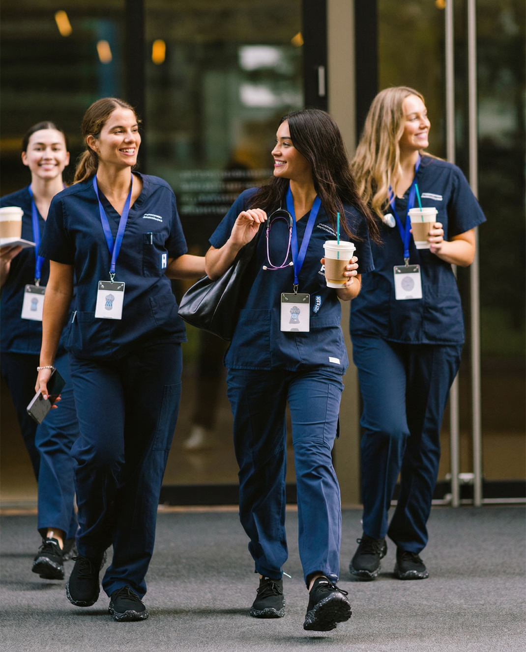 Happy nurses walking confidently in NurseBabes shoes